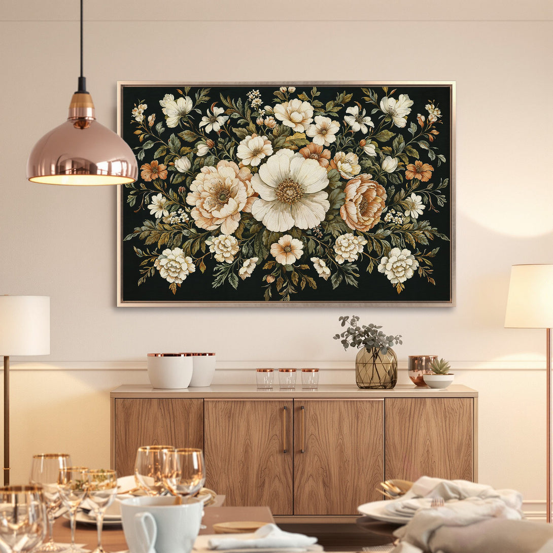 Framed Wall Art featuring a floral design in cream, orange, and green hues. Elegant canvas print perfect for adding a touch of sophistication to any room.