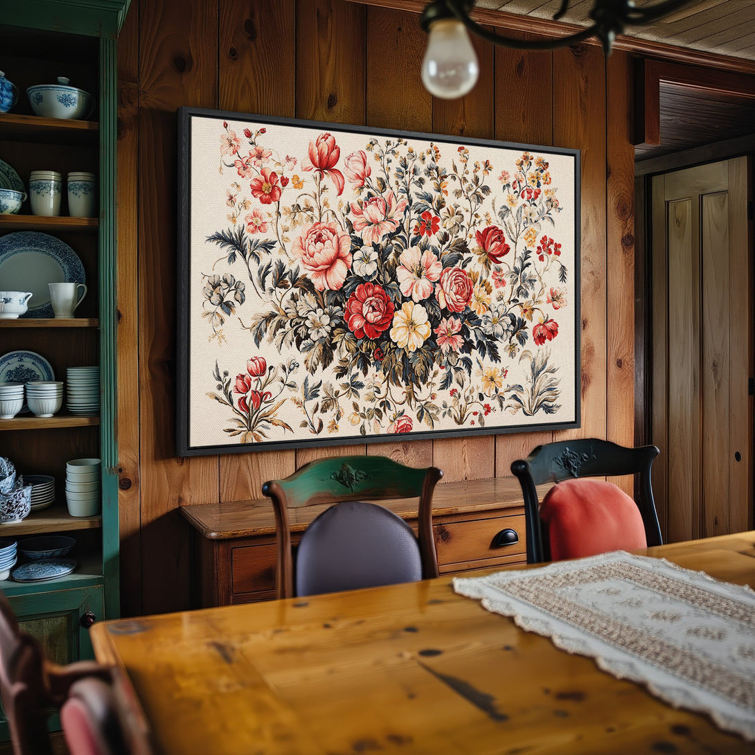 Framed Wall Art featuring a vibrant floral print in a rustic interior. Warm color palette with reds, pinks, and yellows. Adds a touch of elegance.