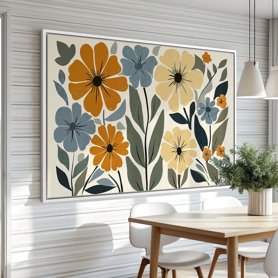 Framed Wall Art featuring a floral design in a mid-century modern style. Warm orange, blue, and yellow flowers brighten any space.