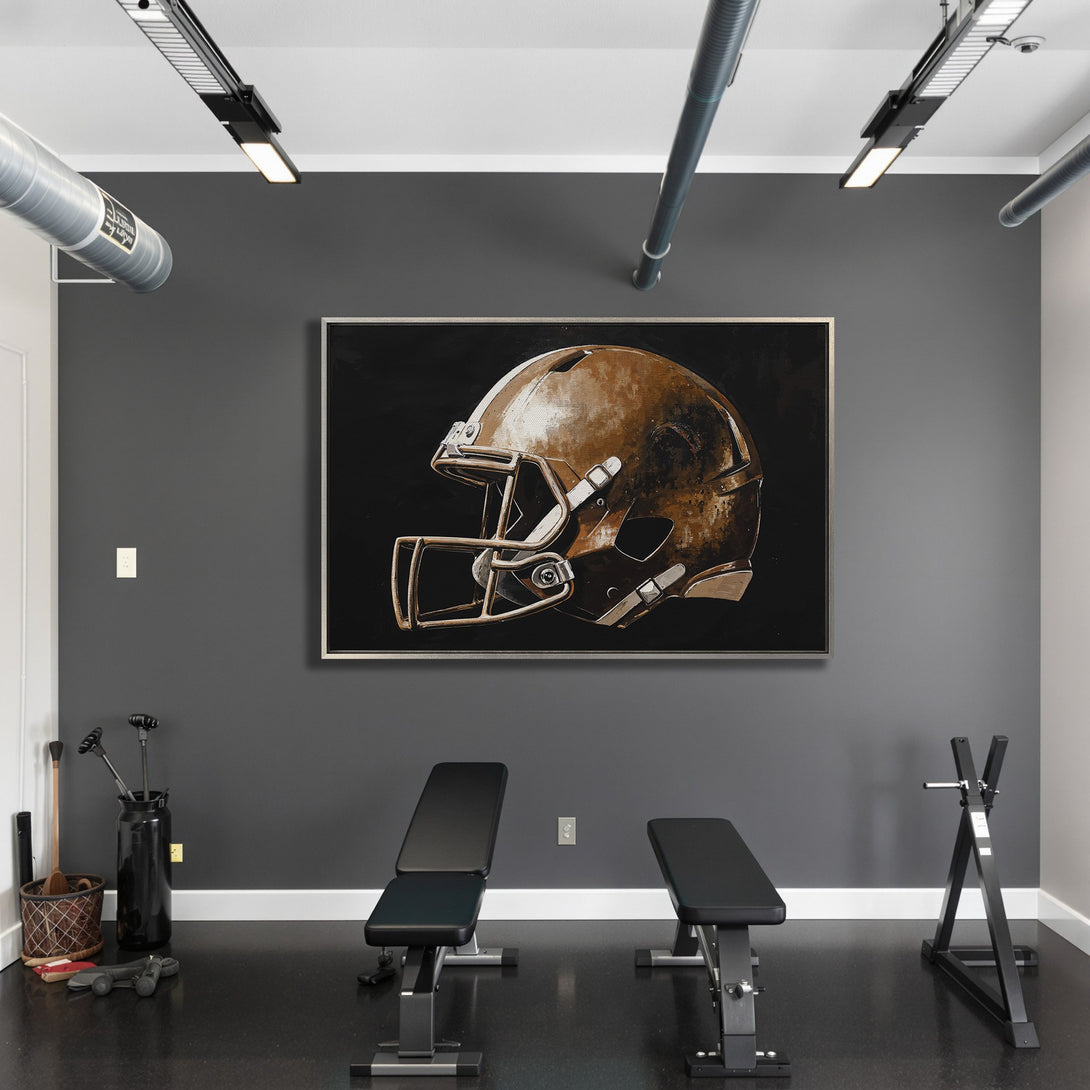 Framed Wall Art of a football helmet in a modern style, featuring a warm bronze and black color palette. Perfect for your home gym!
