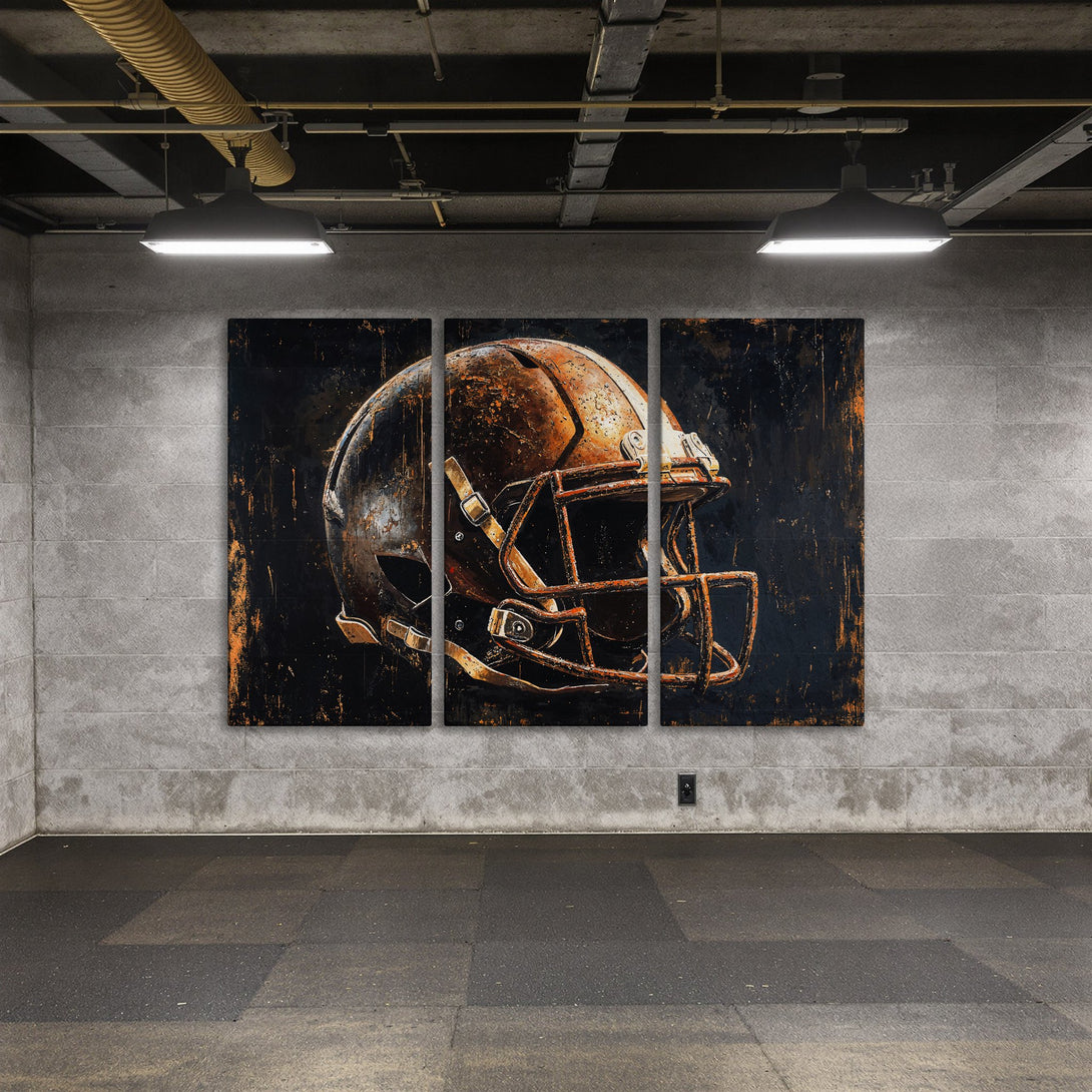 Canvas Print of a grunge football helmet in black and orange. Industrial style wall art for your home or office.
