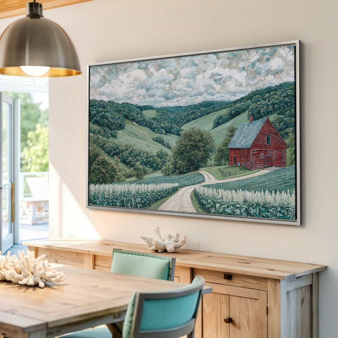 Framed Wall Art of a serene landscape with a red barn, featuring a green and blue color palette, perfect for adding rustic charm.