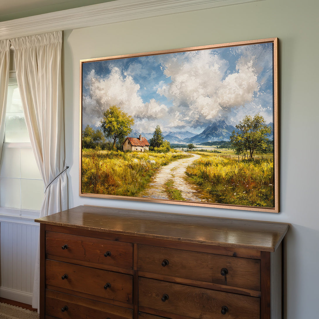 Framed Wall Art: Landscape painting with a cottage, road, and mountains. Warm yellow, green, and blue color palette. Perfect for home decor.