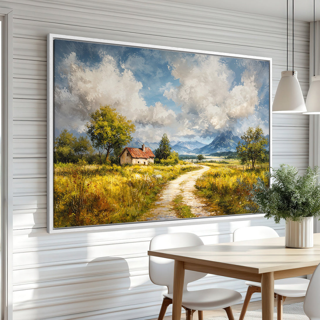 Framed Wall Art: Landscape Canvas Print with a scenic countryside view, featuring a house, road, and mountains in a warm, impressionistic style with blue, yellow, and green tones.