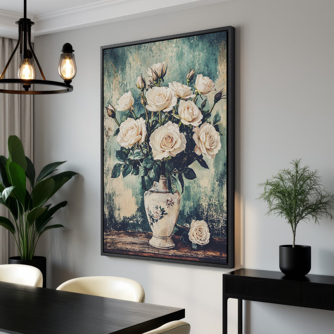 Framed Wall Art of white roses in a vase. Vintage style with a teal and cream color palette. Perfect for adding elegance to your home decor.