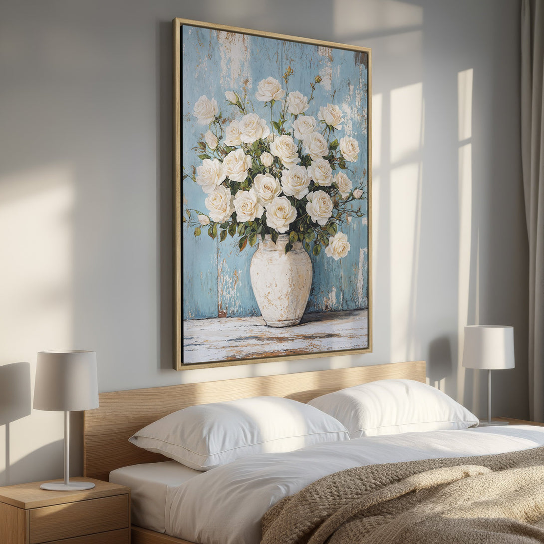 Framed Wall Art: Elegant floral print featuring white roses in a vase, set against a blue backdrop. Adds a touch of sophistication with a neutral color palette.