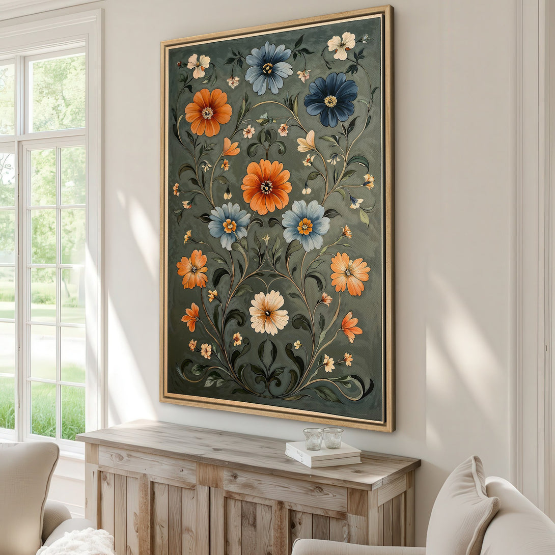 Framed Wall Art featuring a floral design in a vintage style with orange, blue, and green hues, displayed in a cozy interior setting.