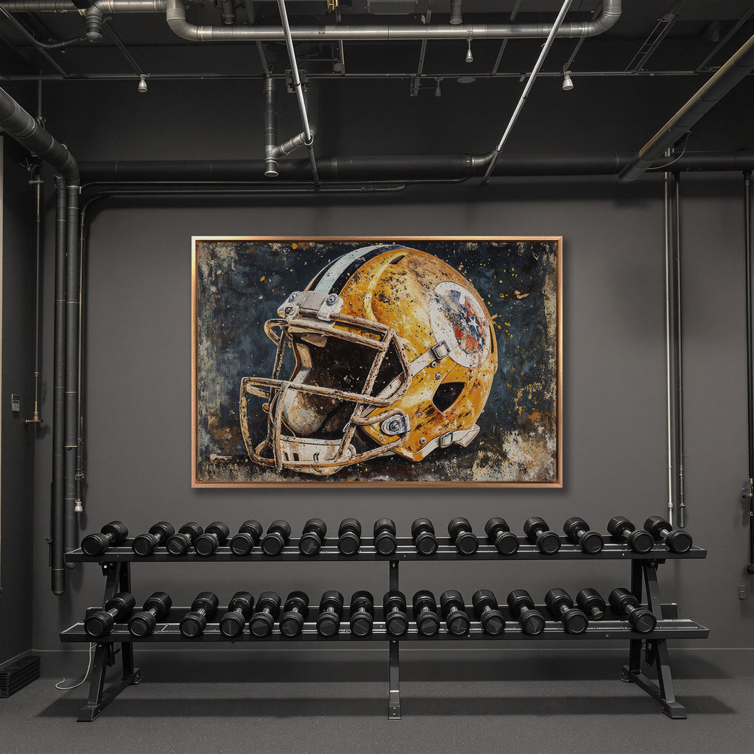 Framed Wall Art of a vintage football helmet in a gym setting. Rustic style with a gold, blue, and brown color palette. Add a touch of sport to your decor!