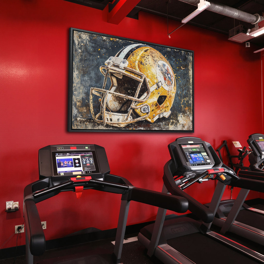 Framed Wall Art: Abstract football helmet in gold and black, displayed in a gym. Rustic style with a warm, neutral color palette. Perfect for sports lovers!