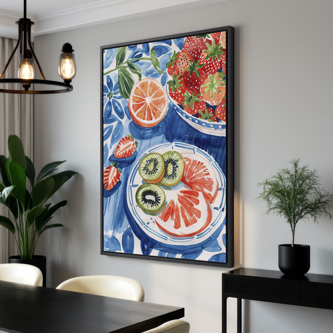 Framed Wall Art featuring a watercolor still life of fruit in a blue and red color palette. Perfect for kitchen decor!
