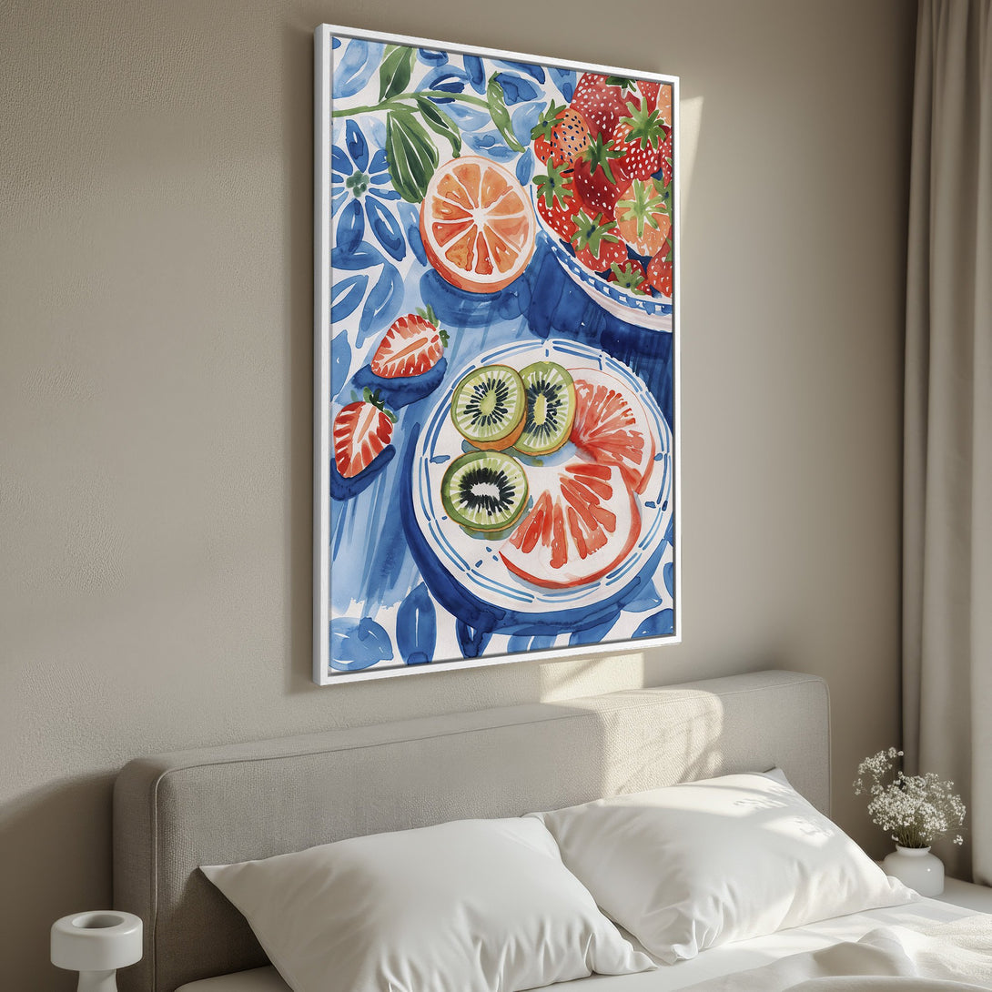 Framed Wall Art featuring a watercolor still life of fruit. Blue and white floral background with vibrant oranges, strawberries, and kiwi. Perfect for kitchen or bedroom decor.