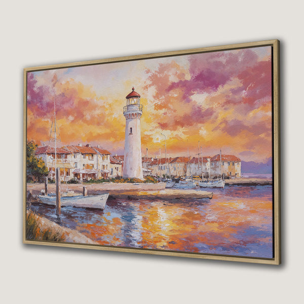Framed Wall Art: Coastal lighthouse painting in warm sunset colors. Perfect for adding a touch of nautical charm to your home decor.