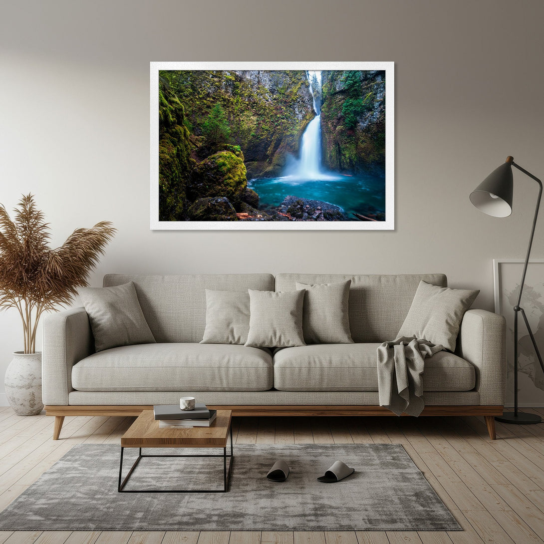 Framed Poster featuring a stunning waterfall scene. Captivating nature art with vibrant blues, greens, and whites. Perfect for adding a touch of serenity to your space.