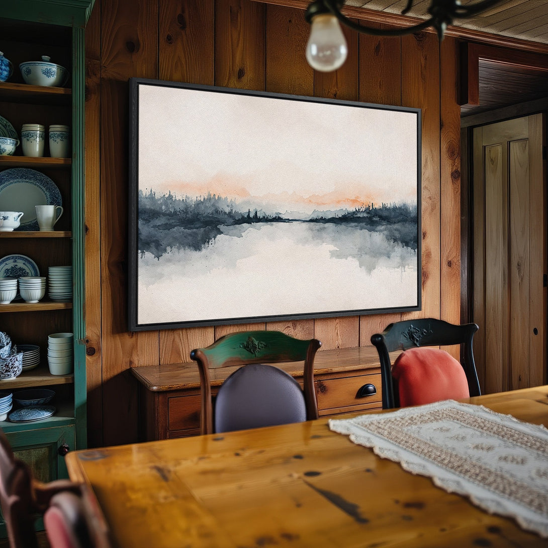 Framed Wall Art: Watercolor landscape Canvas Print in a rustic dining room. Features a serene scene with blue, gray, and peach tones. Perfect home decor.