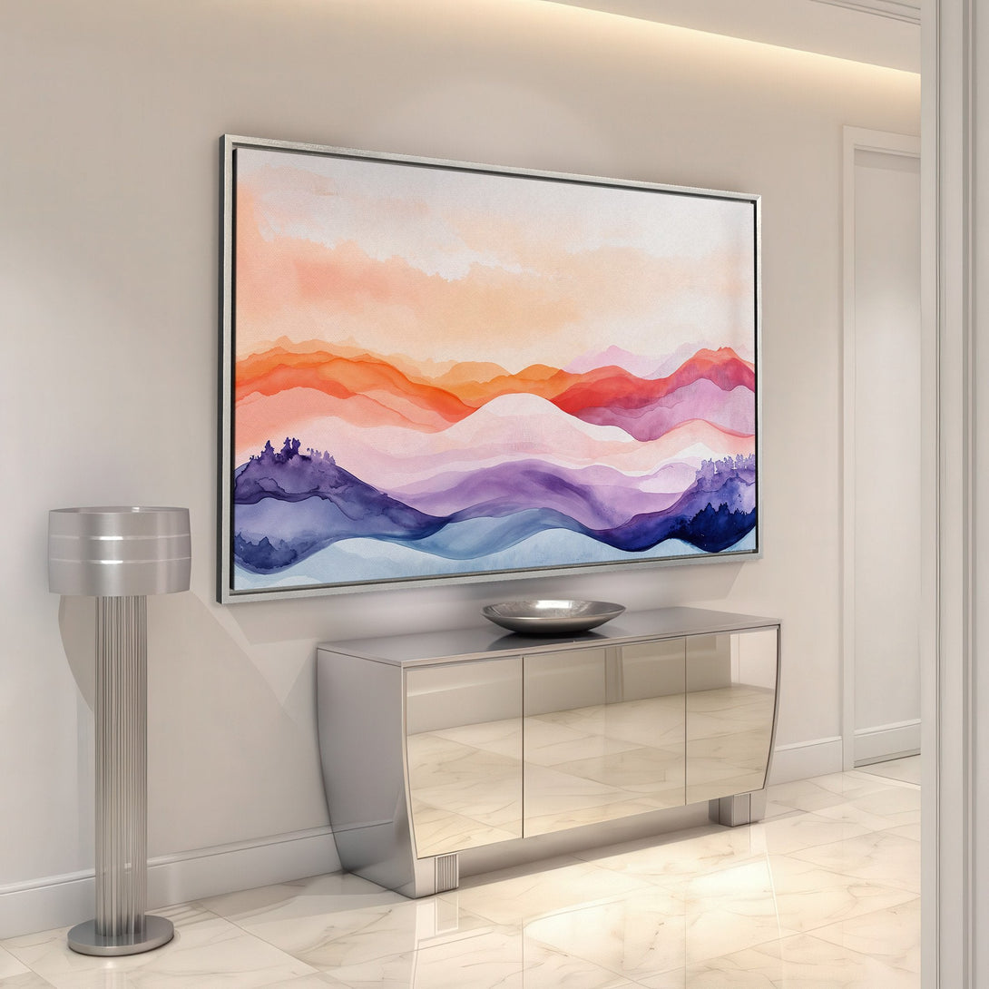 Framed Wall Art featuring watercolor mountain landscape in warm orange, pink, and purple tones. Perfect for adding a touch of art to your home decor.