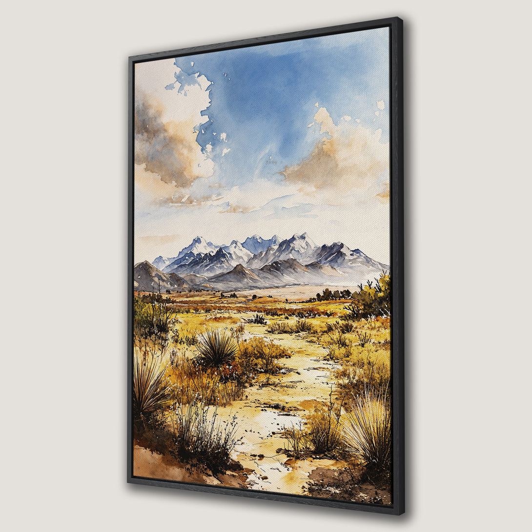Framed Wall Art: Watercolor landscape Canvas Print featuring mountains, desert, and blue sky. Earthy tones of yellow, brown, and blue create a serene aesthetic.