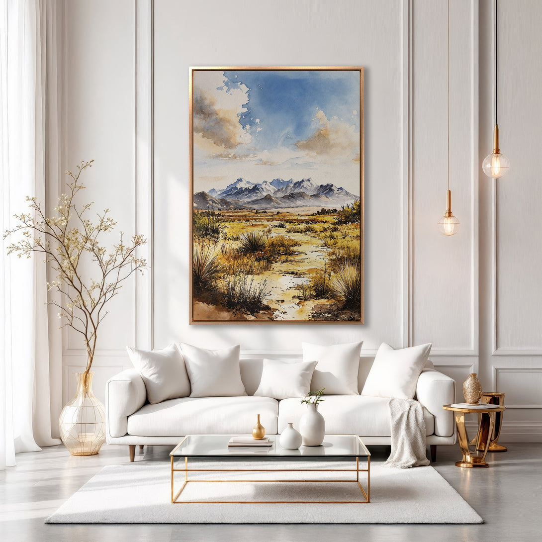 Framed Wall Art: Watercolor landscape painting in a modern interior. Features a desert scene with mountains, blue skies, and warm, earthy tones. Elevate your space!