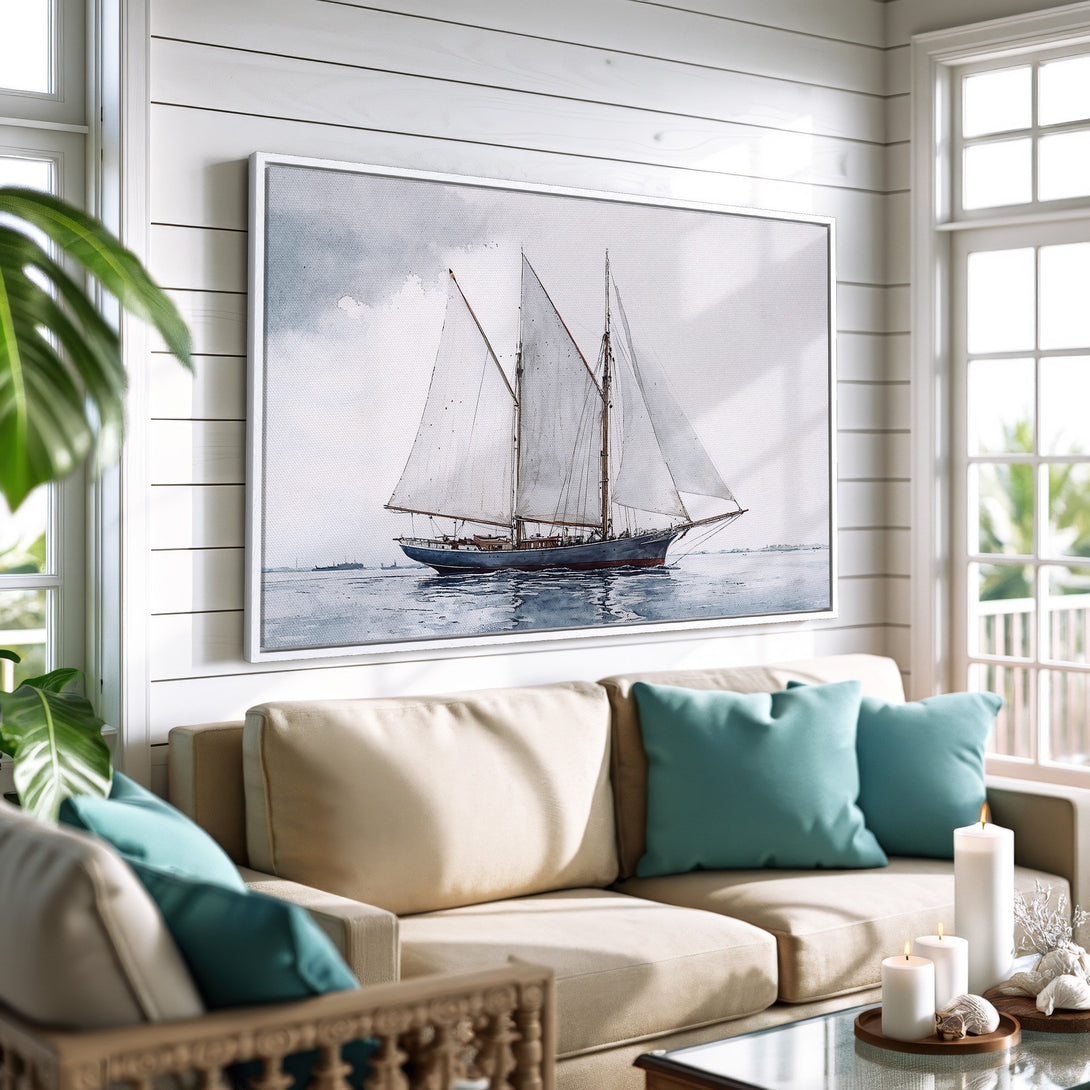 Framed Wall Art: Watercolor sailboat print in a coastal living room. Blue, gray, and beige color palette. Perfect for nautical home decor.