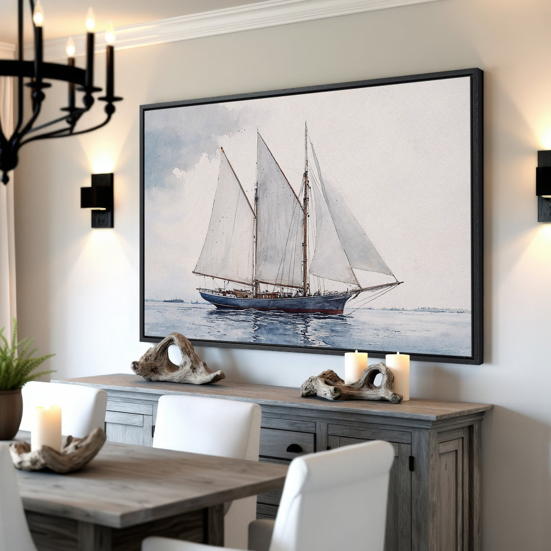 Framed Wall Art: Watercolor sailboat print in a coastal style, featuring a blue and neutral color palette. Perfect for nautical decor.