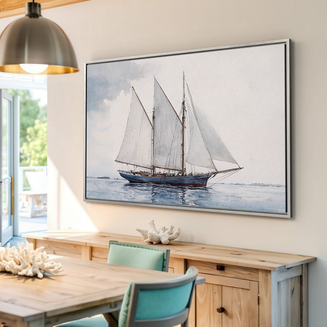 Framed Wall Art: Watercolor sailboat print in cool blue and gray tones. Coastal decor for a serene living space.