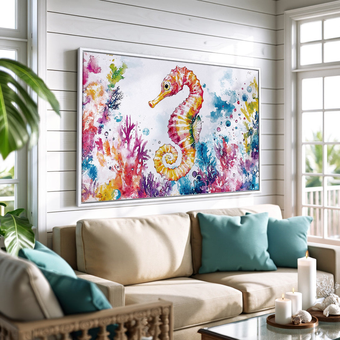 Framed Wall Art featuring a vibrant watercolor seahorse. Coastal style art with a colorful palette of pinks, blues, and yellows. Perfect for beachy decor.