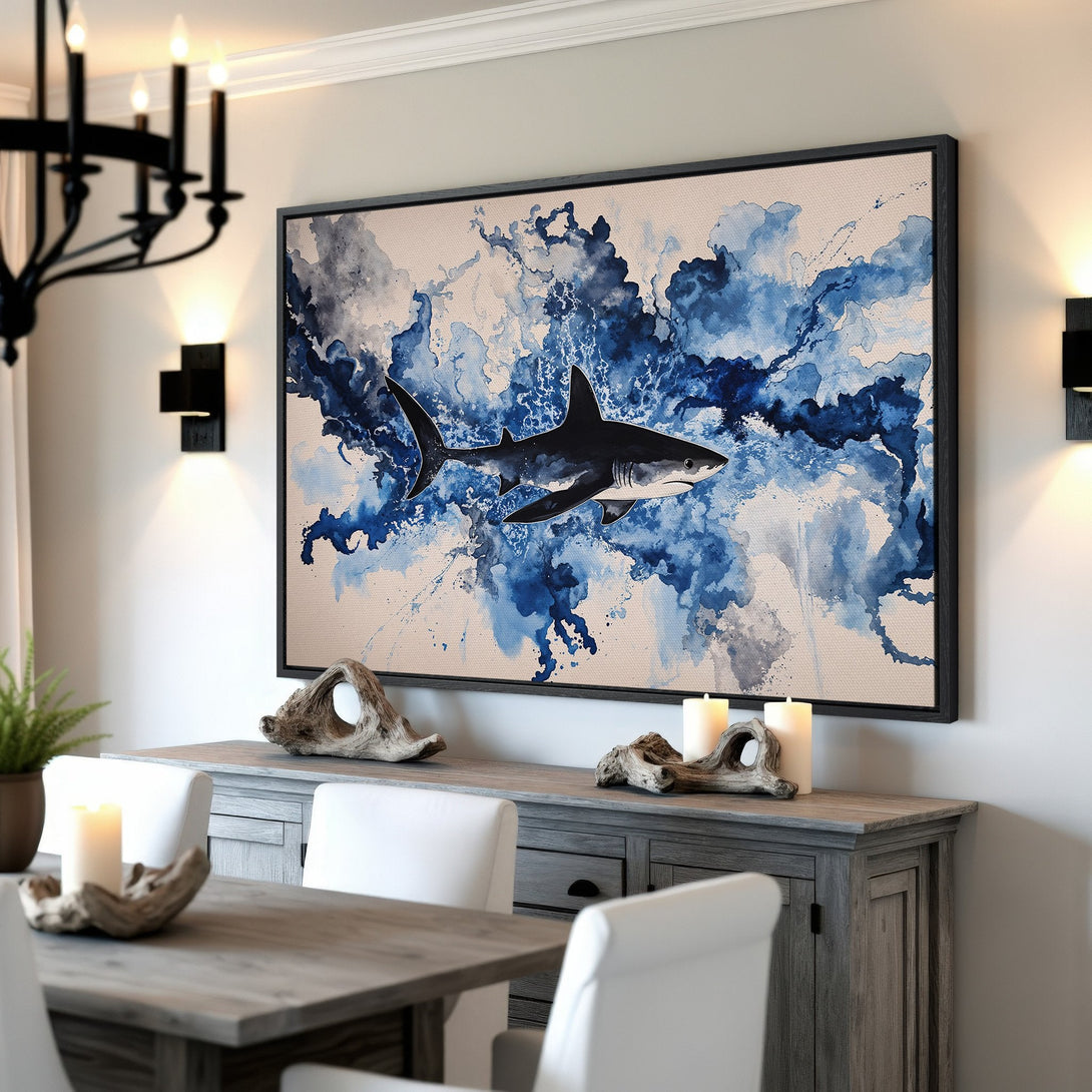 Framed Wall Art: Watercolor shark print in blue hues. Coastal-inspired canvas print adds a splash of art to any room. Shop now!