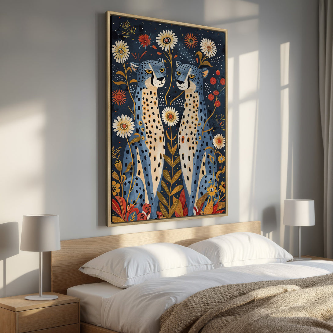 Framed Wall Art featuring stylized cheetahs and floral elements. Artwork in a modern, folk art style with a rich blue, orange, and yellow color palette.