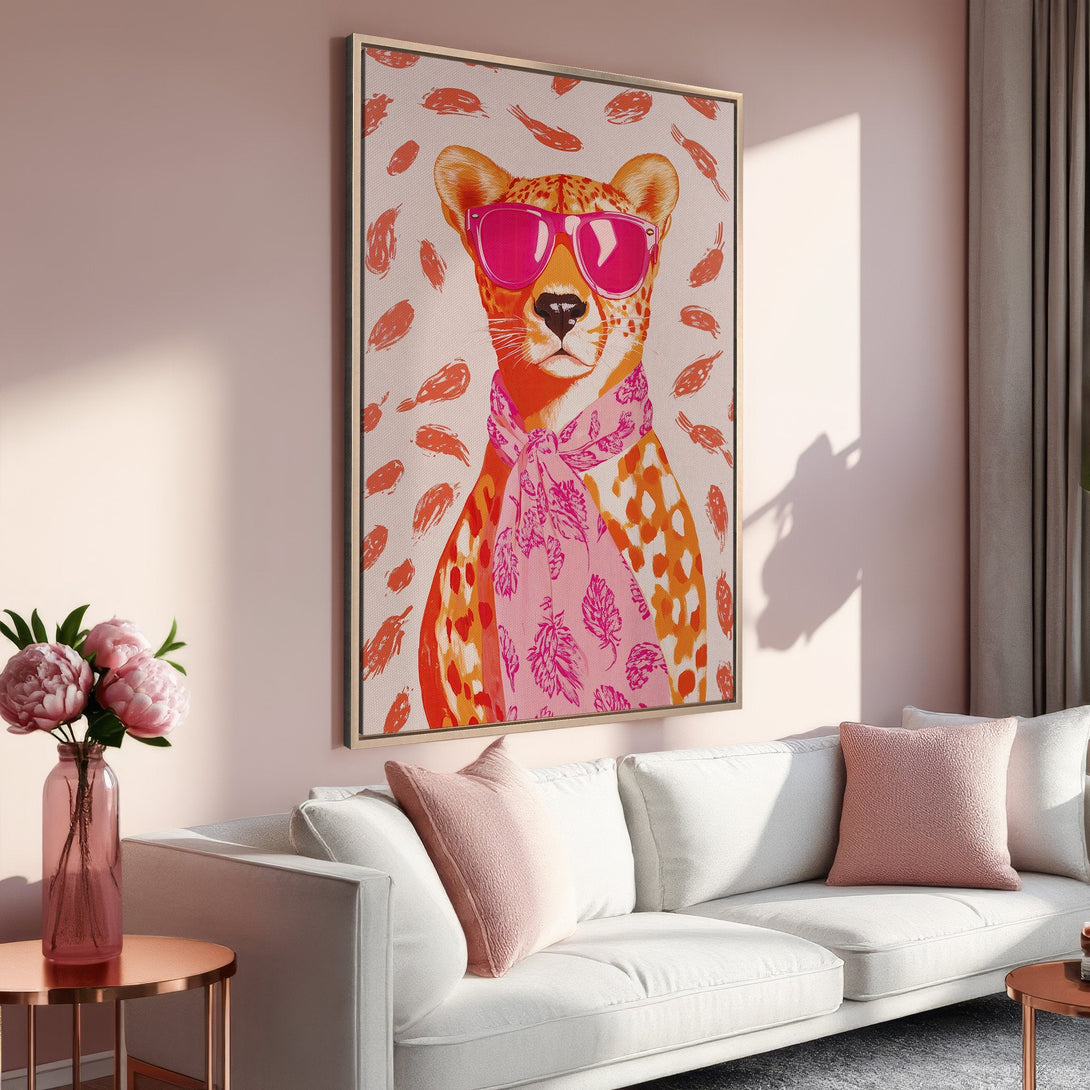 Framed Wall Art featuring a stylish cheetah in pink sunglasses. Modern, colorful art in a pink and orange palette, perfect for adding personality to your space.