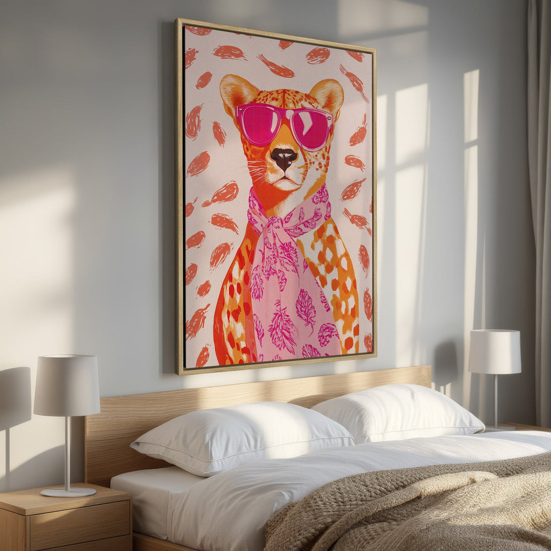 Framed Wall Art: Stylish cheetah print canvas in a bedroom. Modern art with pink and orange hues adds a pop of color and personality to any space.