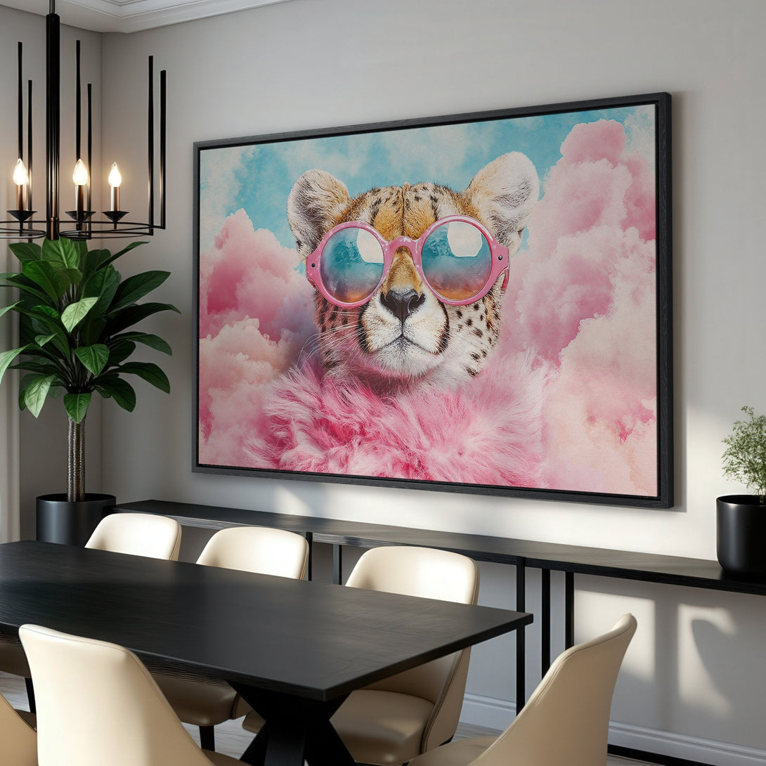 Framed Wall Art featuring a stylish cheetah wearing sunglasses, set against pink clouds and blue sky. Modern art with a vibrant pink and blue color palette.
