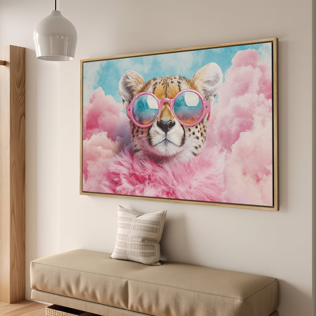 Framed Wall Art featuring a cheetah in sunglasses with a pink cloud background. Whimsical style, pastel color palette. Perfect for adding personality to any space.