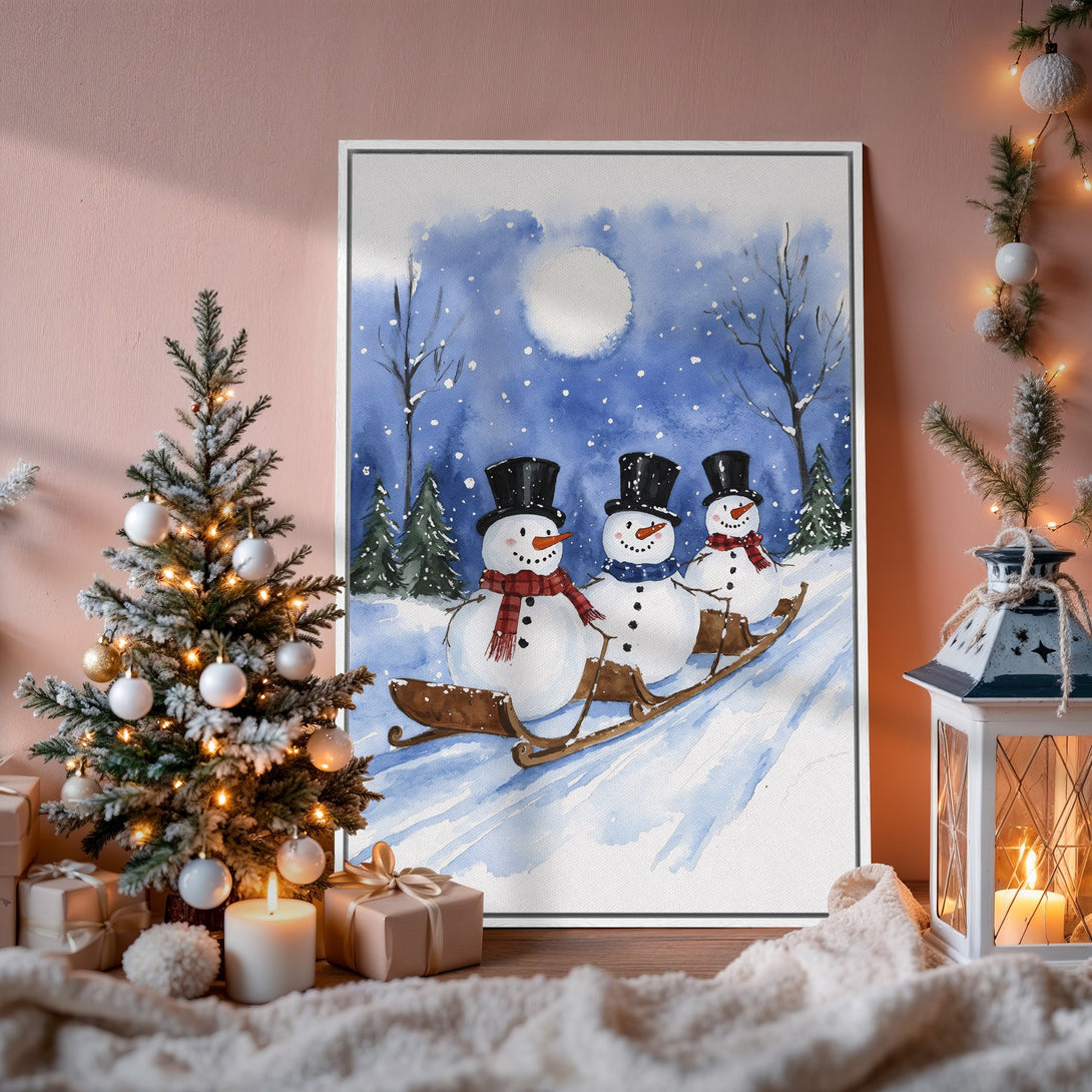 Framed Wall Art: Watercolor snowmen on a sled in a winter scene. Blue and white color palette, perfect for Christmas decor. Bring the holiday spirit home!