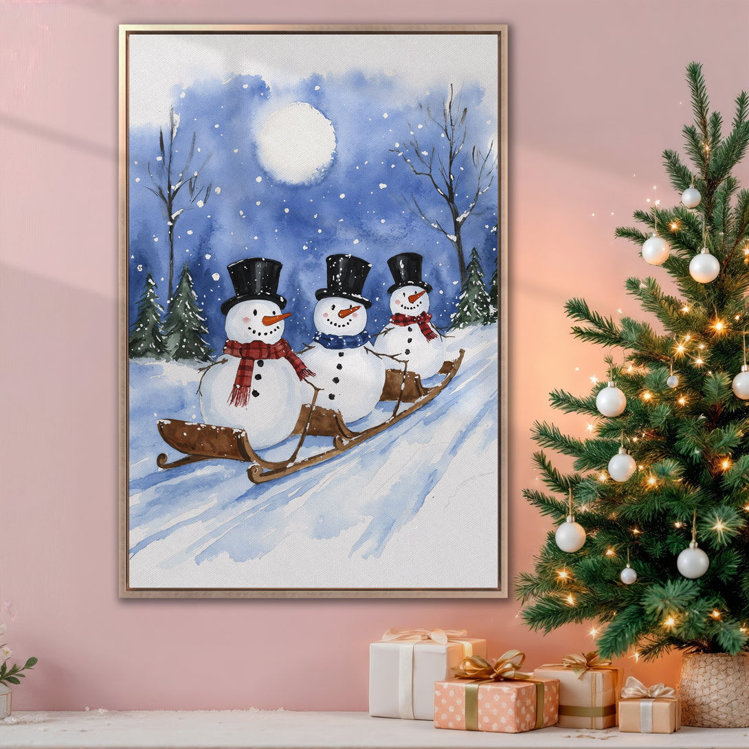 Framed Wall Art: Watercolor painting of snowmen sledding in a winter scene. Blue, white, and brown color palette. Perfect Christmas decor.