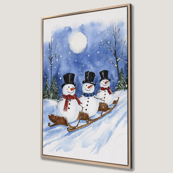 Framed Wall Art: Watercolor painting of snowmen sledding in a winter scene. Blue and white color palette, perfect for holiday decor.