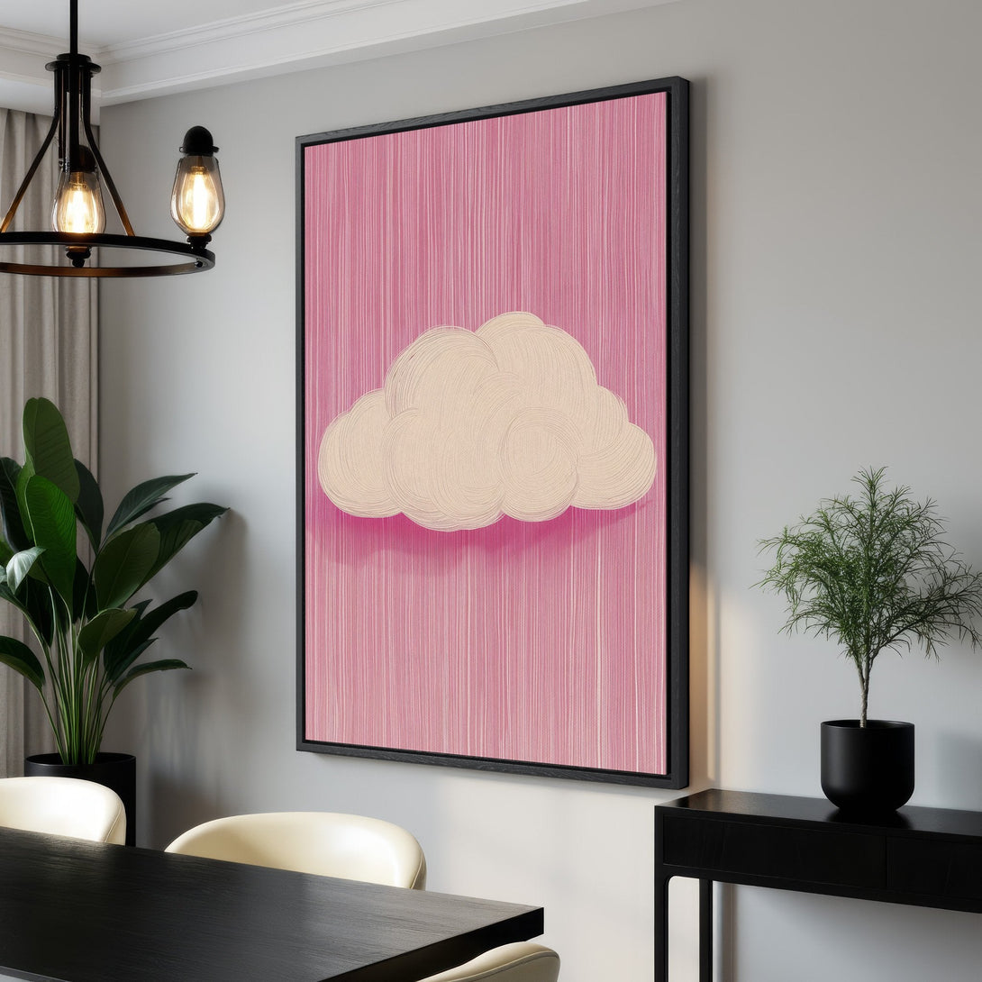 Framed Wall Art featuring a whimsical cloud on a pink background. Modern art style with a soft, pastel color palette. Perfect for adding a touch of style to any room.