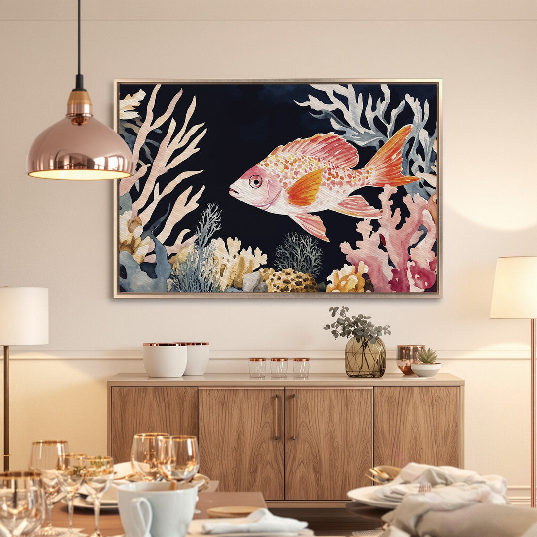 Framed Wall Art featuring a watercolor fish with coral reef elements. Coastal style in a navy, coral, and gold color palette. Perfect for dining room decor.