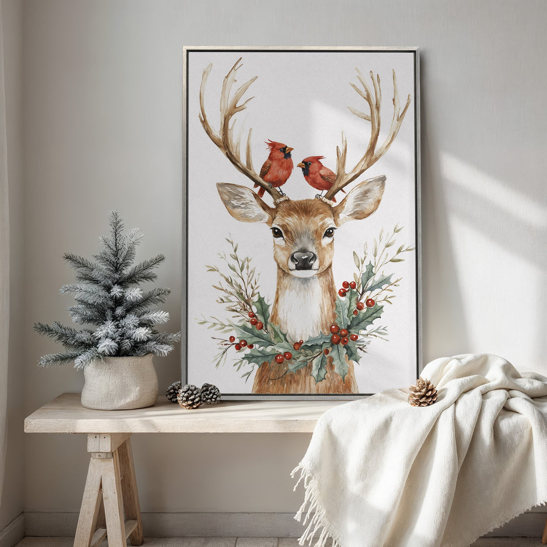 Framed Wall Art: Watercolor deer with cardinals, holly wreath, and warm, neutral tones. Perfect for cozy Christmas decor. Shop now!