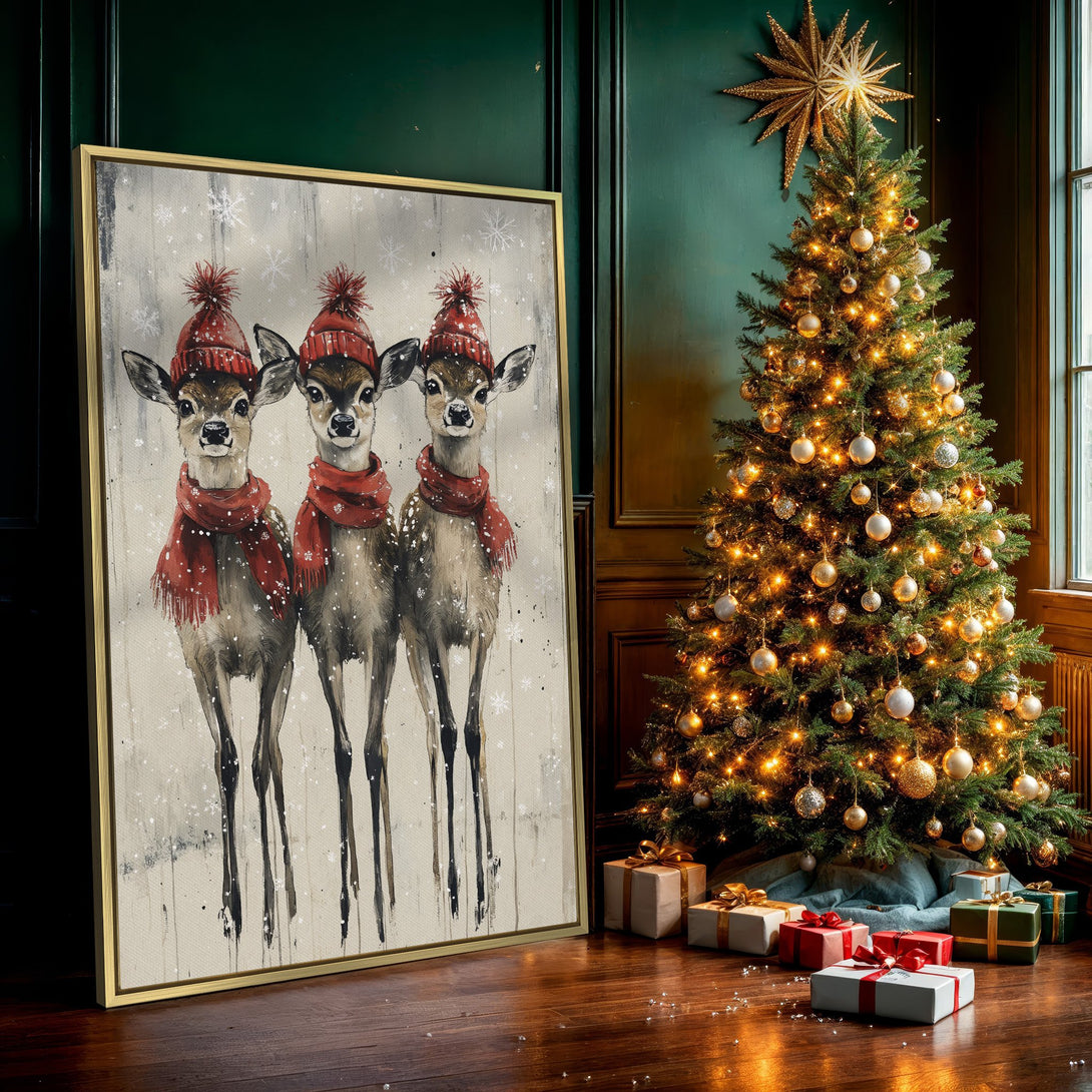 Canvas Print featuring three adorable deer in red hats and scarves, whimsical watercolor style, neutral and red color palette, perfect for winter decor.