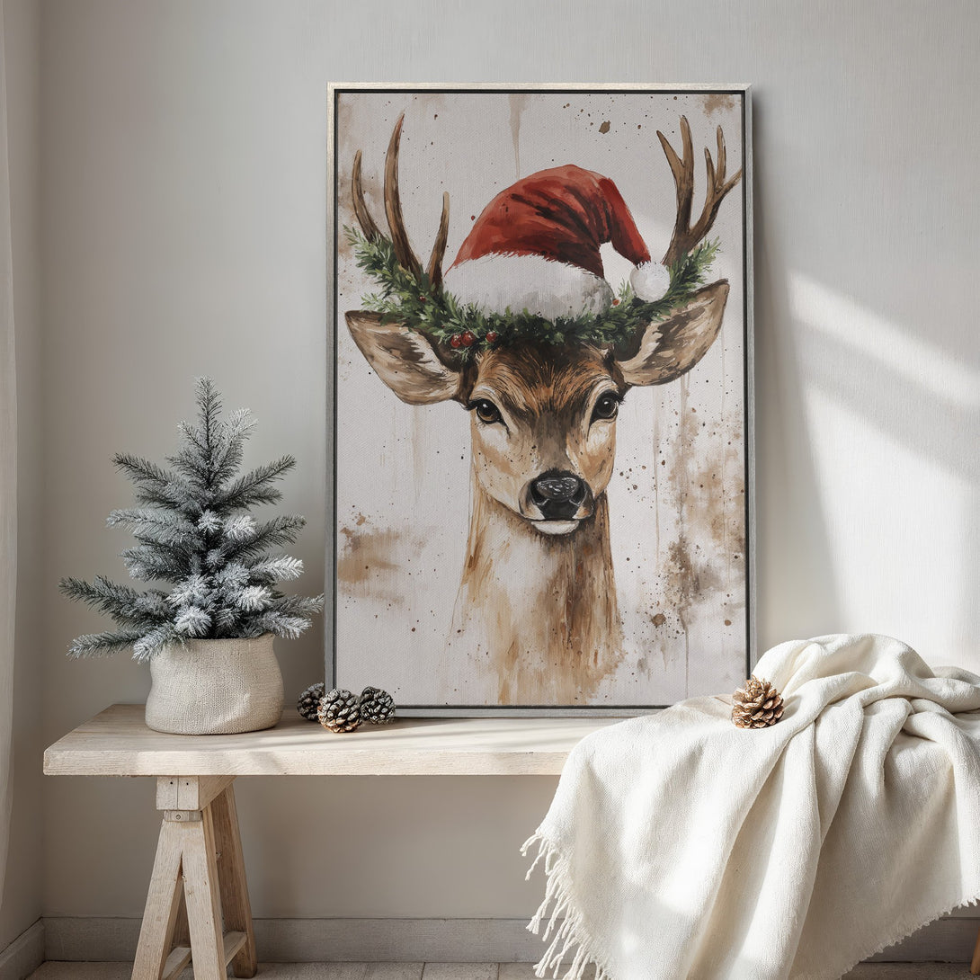 Framed Wall Art: Watercolor deer wearing a Santa hat. Festive holiday decor in warm neutral tones. Perfect Christmas wall art for your home!