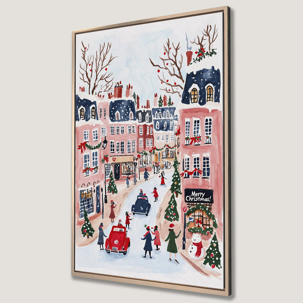 Framed Wall Art: Watercolor Christmas scene with pink buildings, red accents, and a snowy street. Festive wall decor in a warm, inviting color palette.