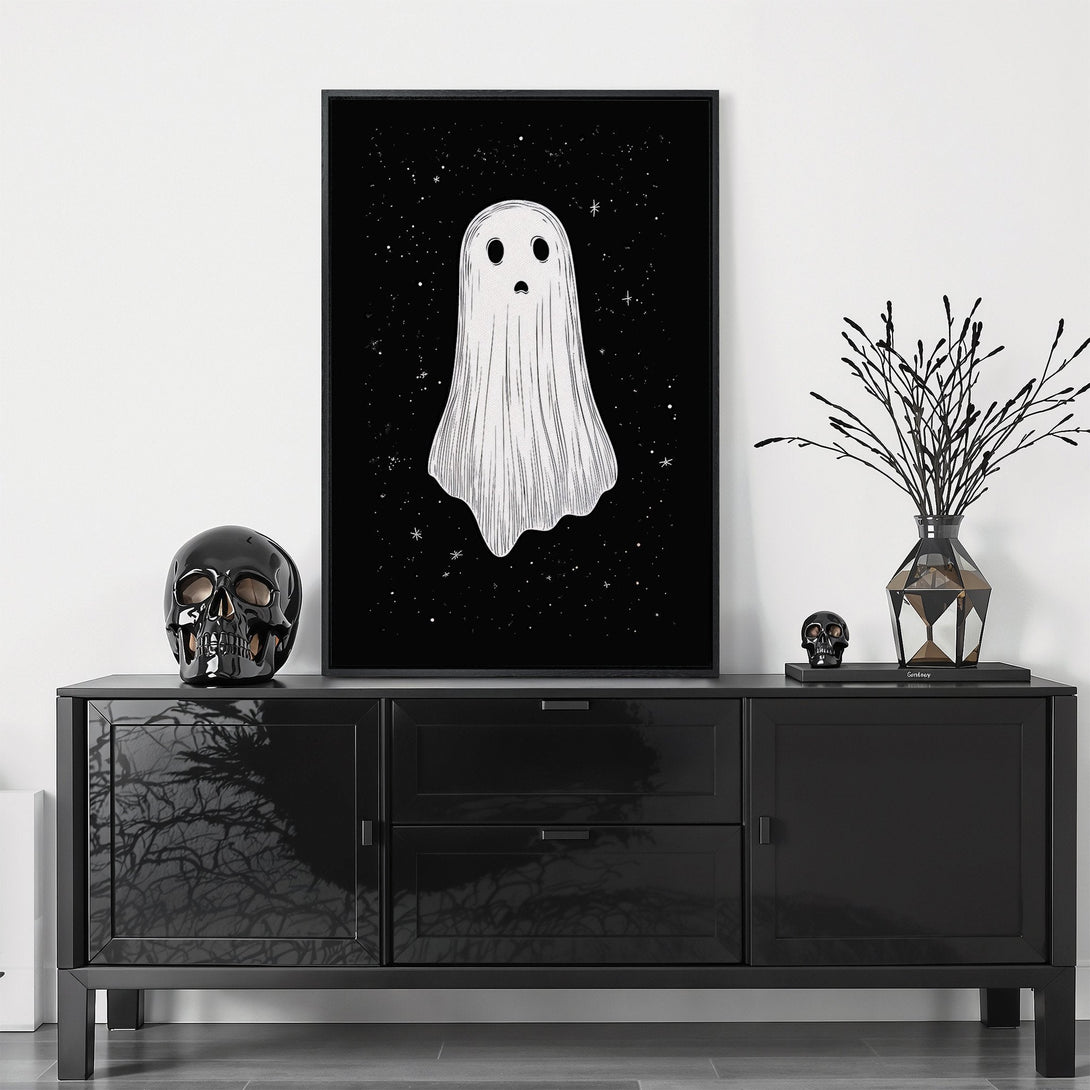 Framed Wall Art featuring a spooky ghost illustration with a black and white color palette, perfect for Halloween decor. Add a touch of eerie charm to your space!