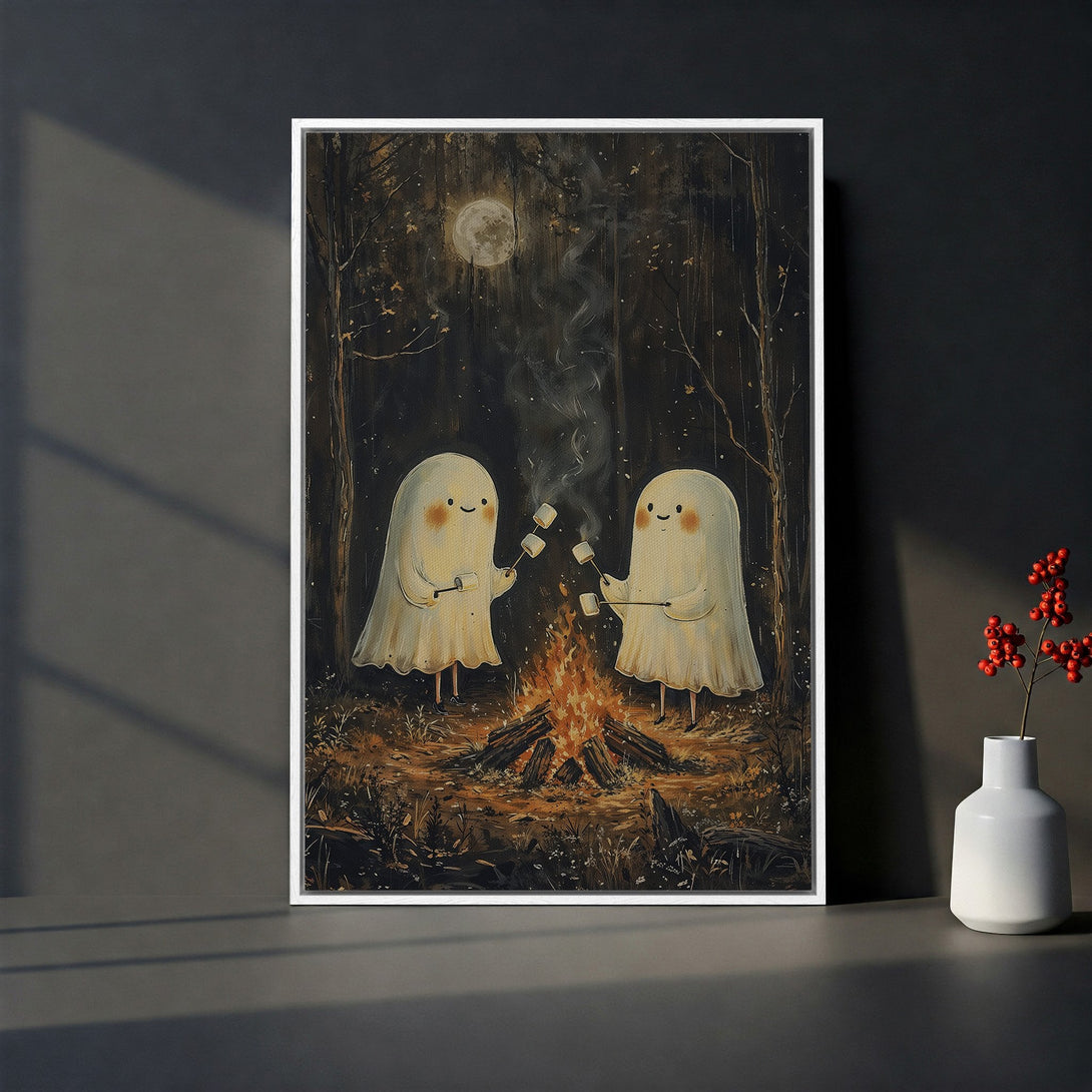 Framed Wall Art of cute ghosts roasting marshmallows by a campfire in a whimsical, dark forest scene. Earthy tones with pops of warm orange and white.