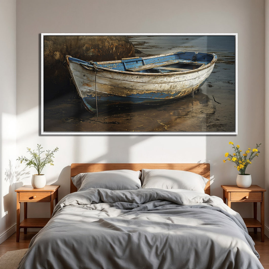 Framed Wall Art: Coastal boat art in blue and white, displayed in a bedroom. Rustic style with warm, neutral tones for a calming interior.