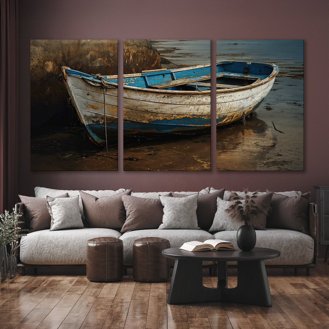 Canvas Print of a weathered boat in a coastal scene, warm neutral tones with blue accents, displayed in a modern living room.
