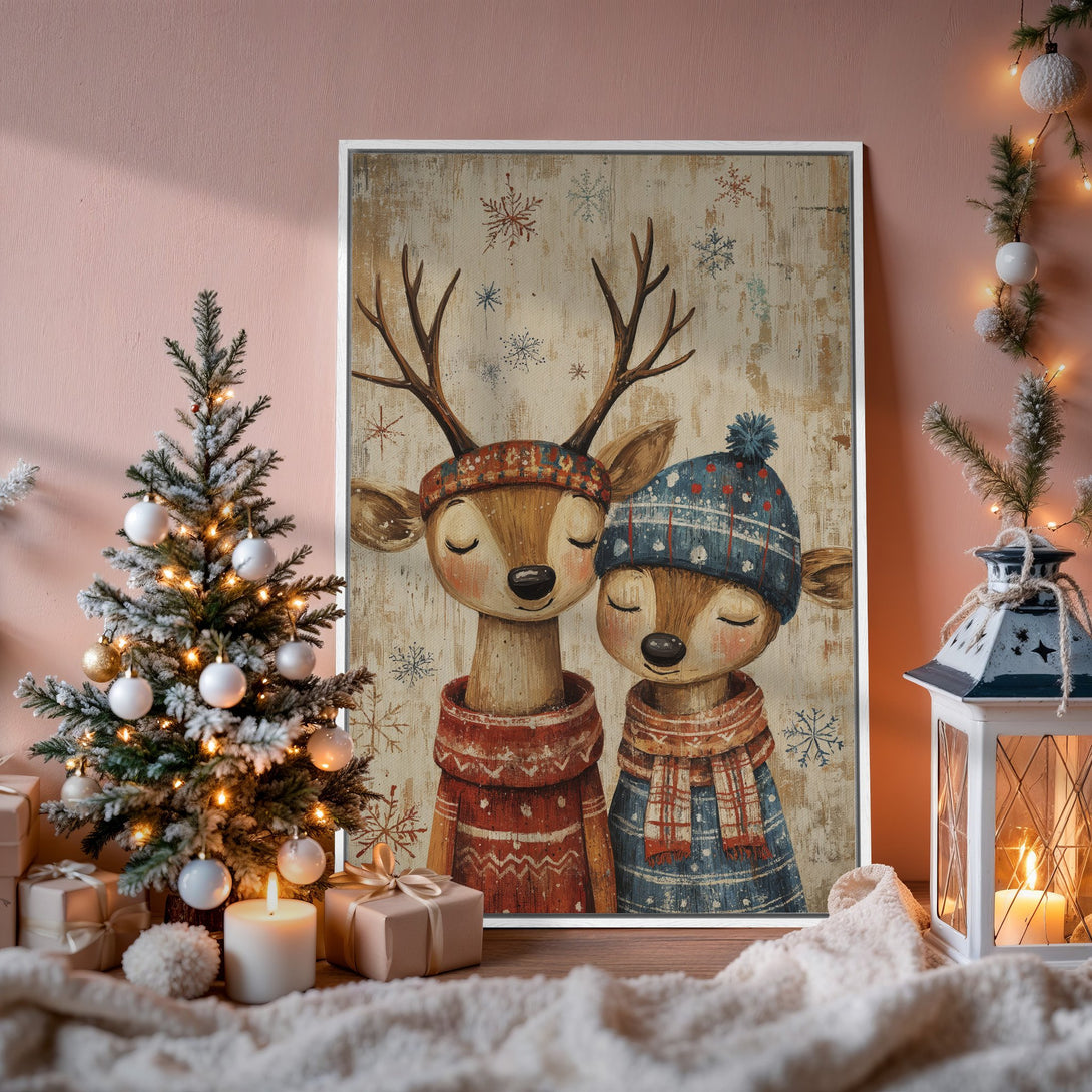 Framed Wall Art: Adorable deer couple in winter attire. Rustic style with warm red, blue, and beige tones. Perfect Christmas decor for cozy homes!