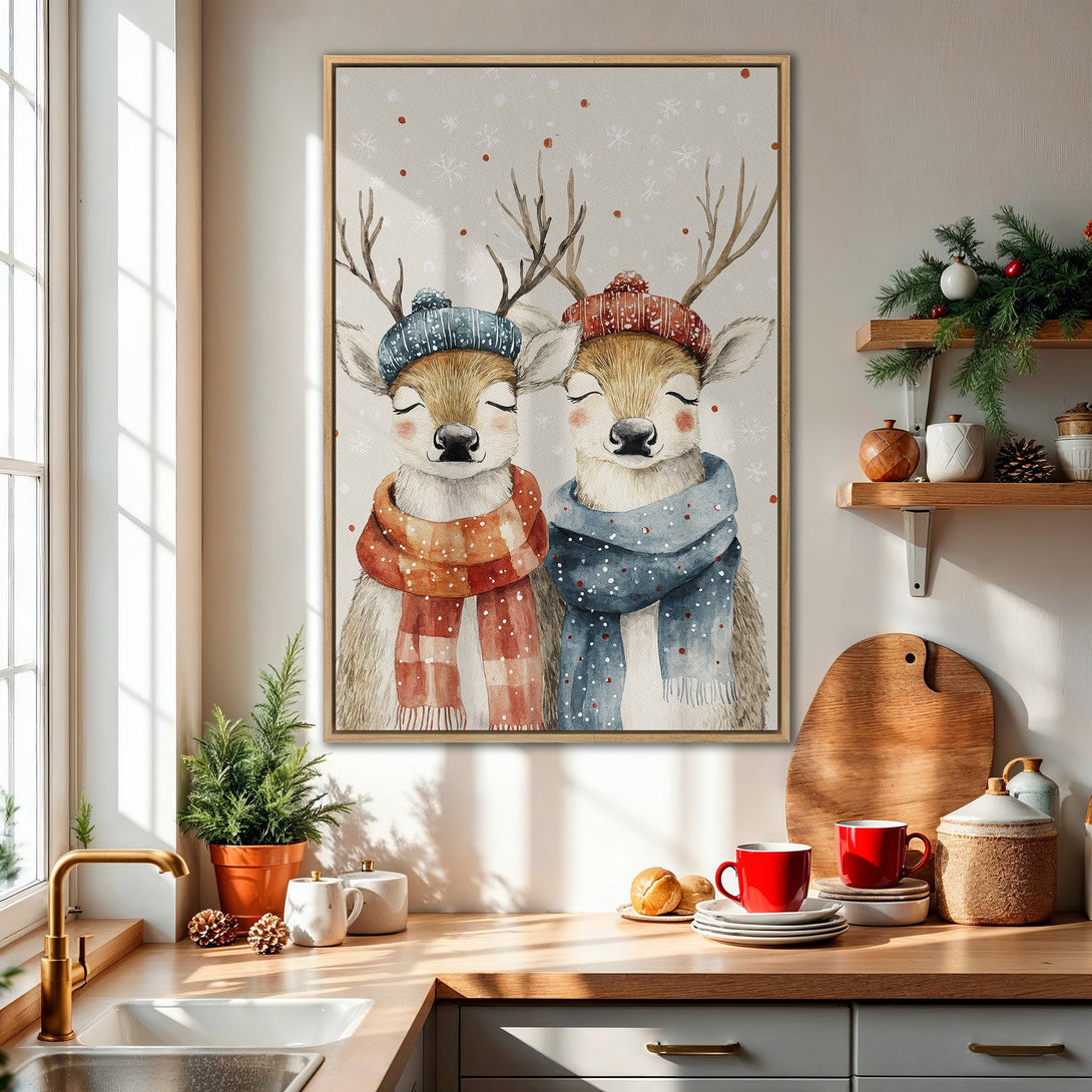 Framed Wall Art featuring watercolor deer in winter hats and scarves. Cozy, warm color palette with beige, red, and blue tones. Perfect for holiday decor!