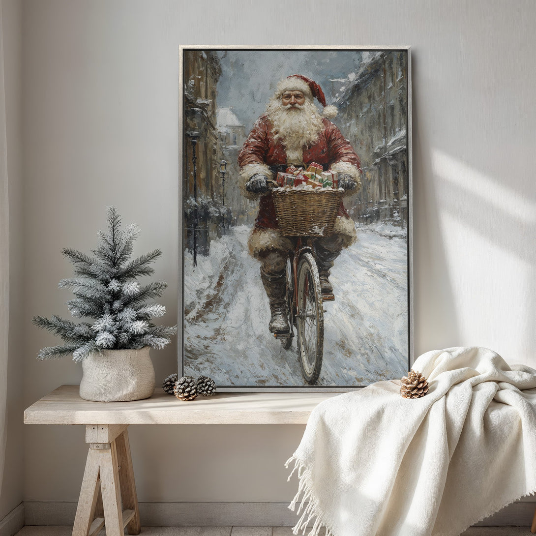 Framed Wall Art featuring Santa Claus on a bicycle in a snowy scene. Vintage style with a warm red and cool blue color palette. Perfect for Christmas decor.