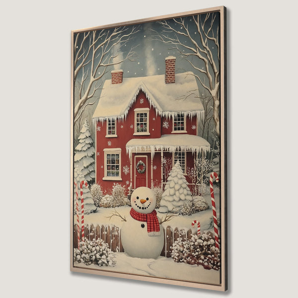 Framed Wall Art: Winter scene with a red house, snowman, and snowy landscape. Warm red, white, and blue color palette. Perfect for Christmas decor.
