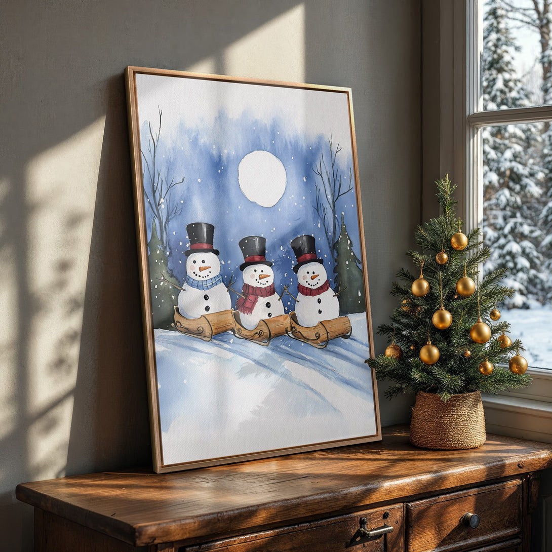 Framed Wall Art featuring watercolor snowmen in a winter scene. Blue and white color palette, perfect for holiday decor. Add charm to your home!