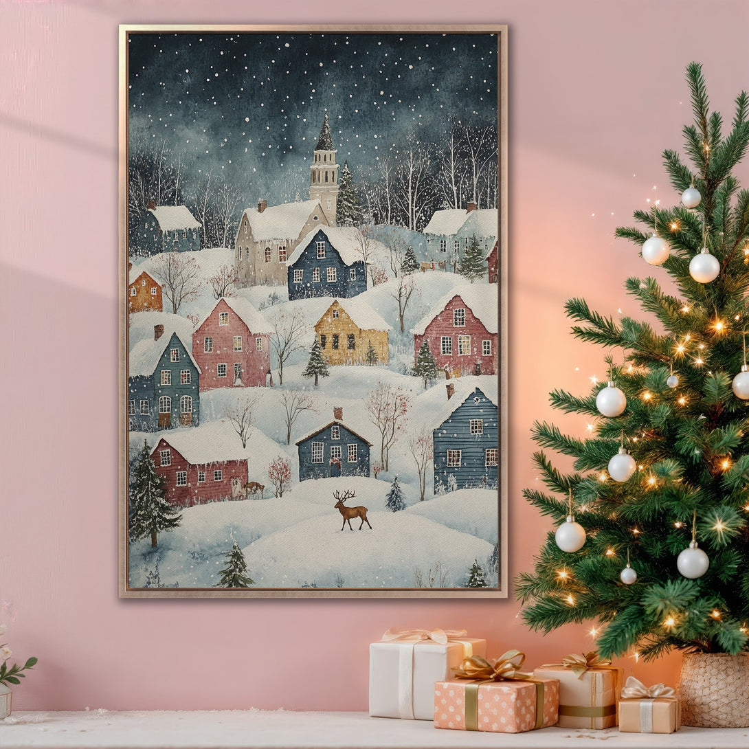 Framed Wall Art: Winter village scene canvas print with a cozy, watercolor style. Featuring a snowy landscape in blue, pink, and warm tones. Perfect holiday decor.